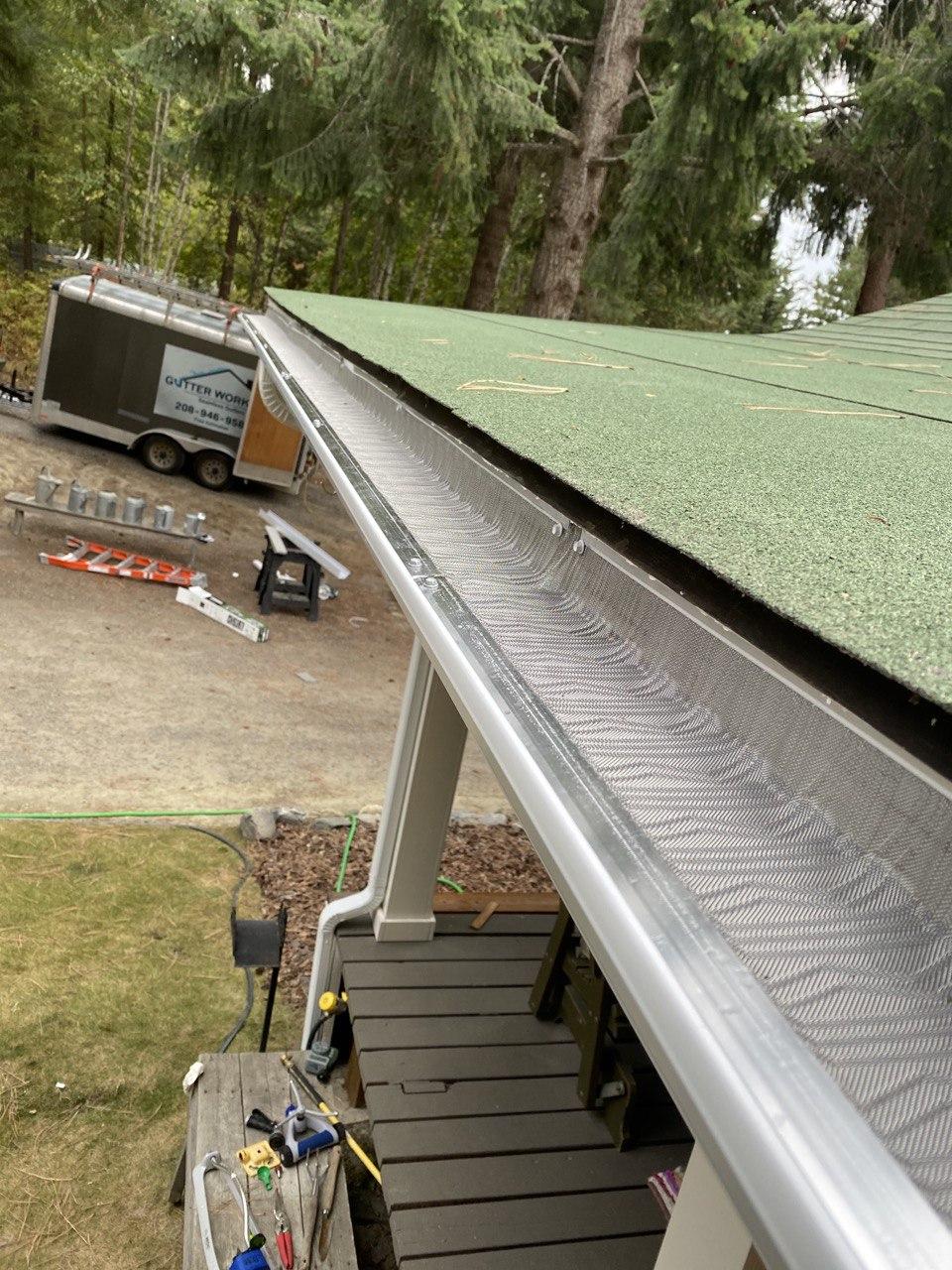 Seamless gutters with leaf guard installed
