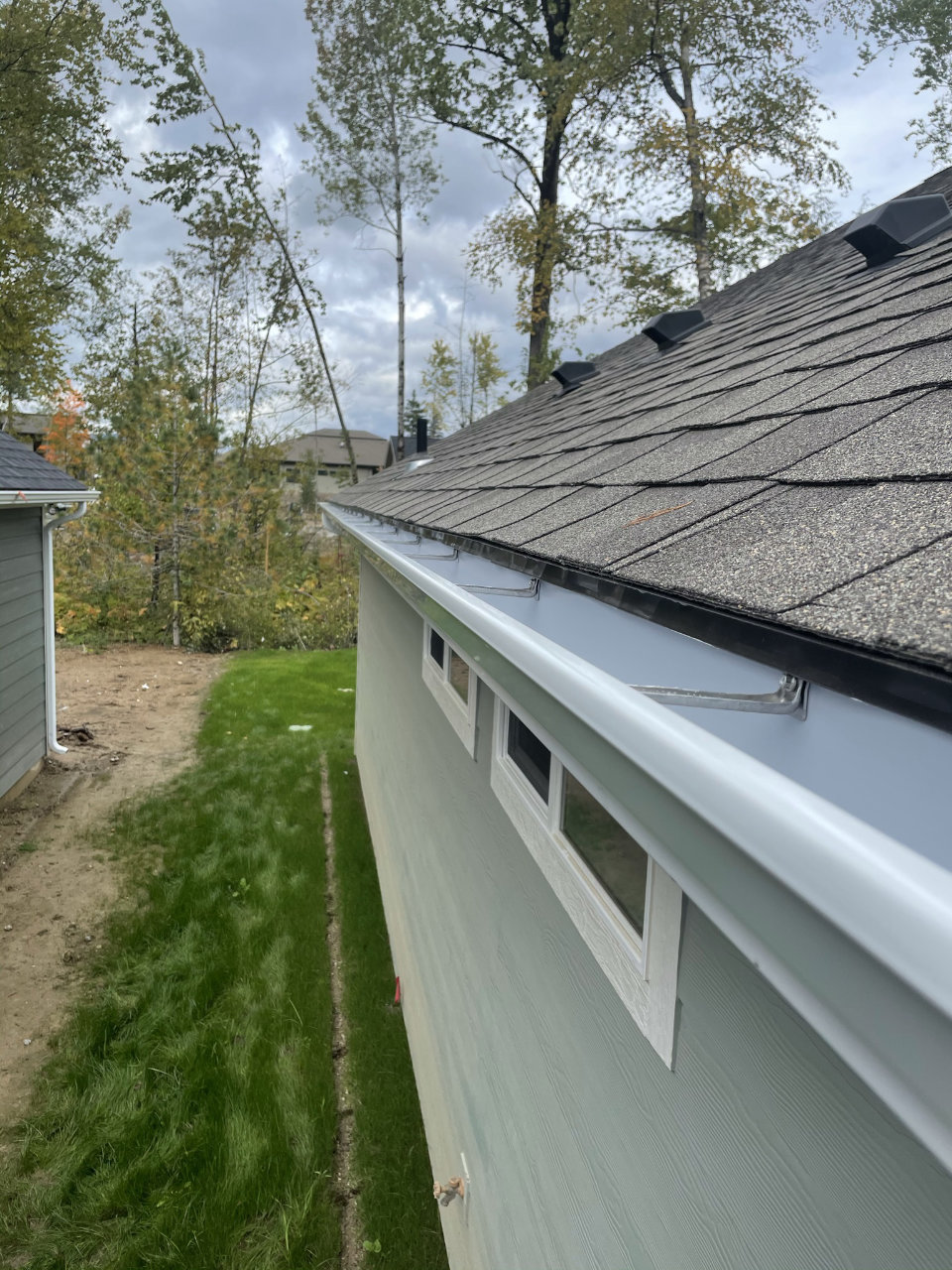 Gutter installation on residential roofline