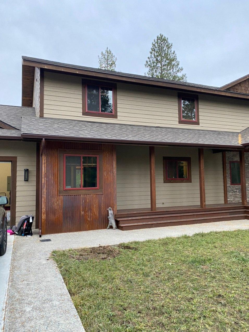 Seamless gutter installation on two-story home