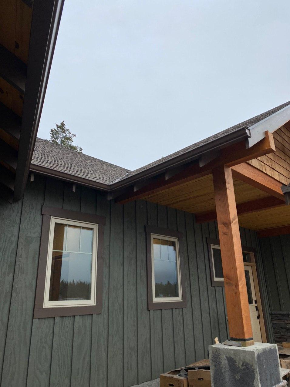 Seamless gutter installation on covered porch